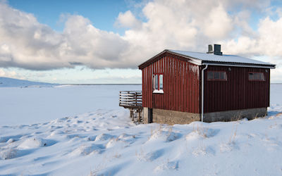 Wooden red house photo by Federico Bottos on Unsplash